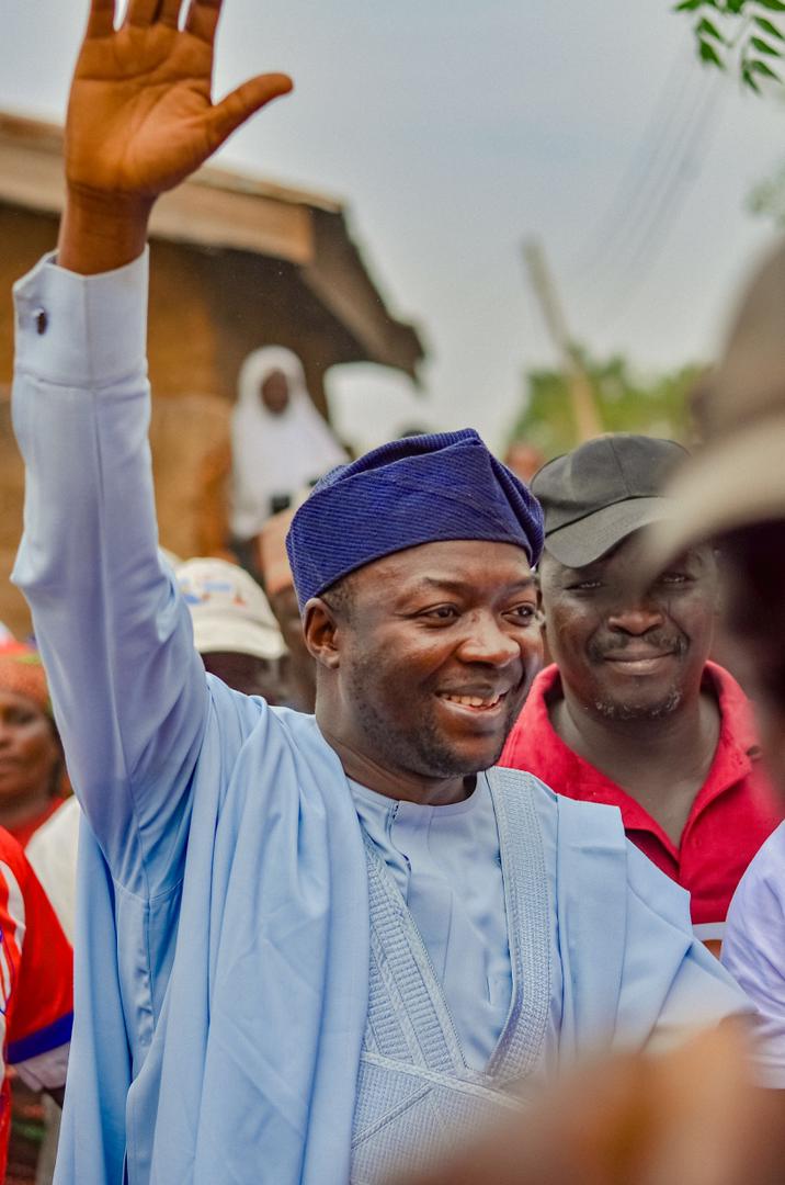 Barji waving to supporters on the campaign trail